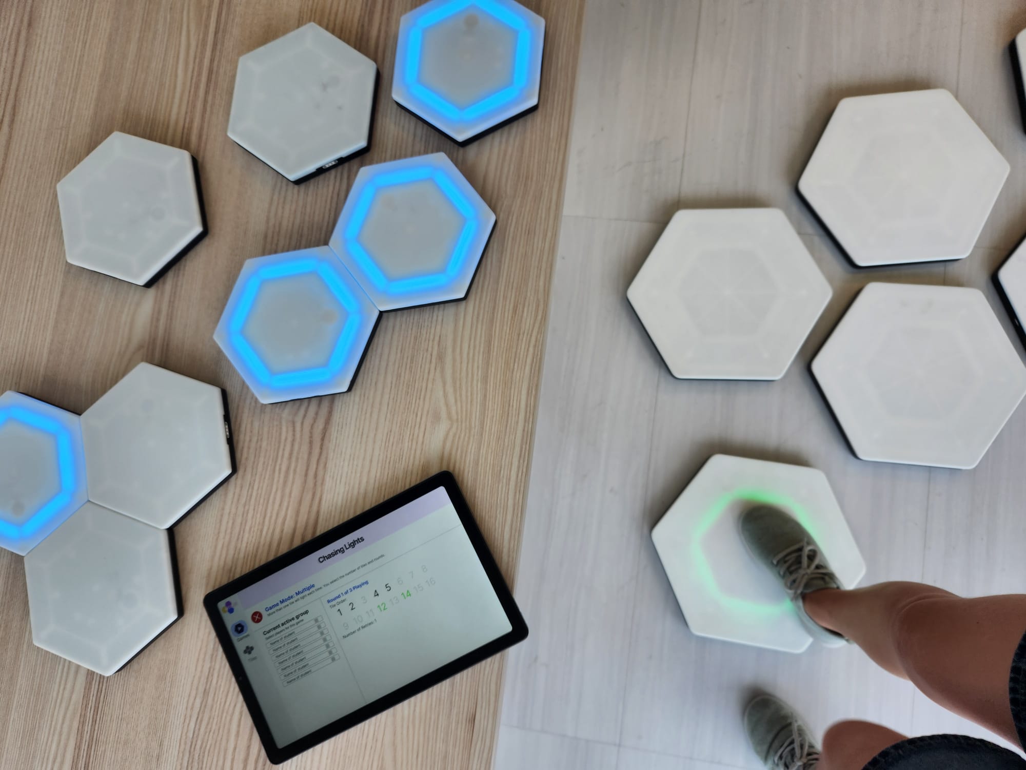 Many hexagonal tiles, with three lit up in blue.
